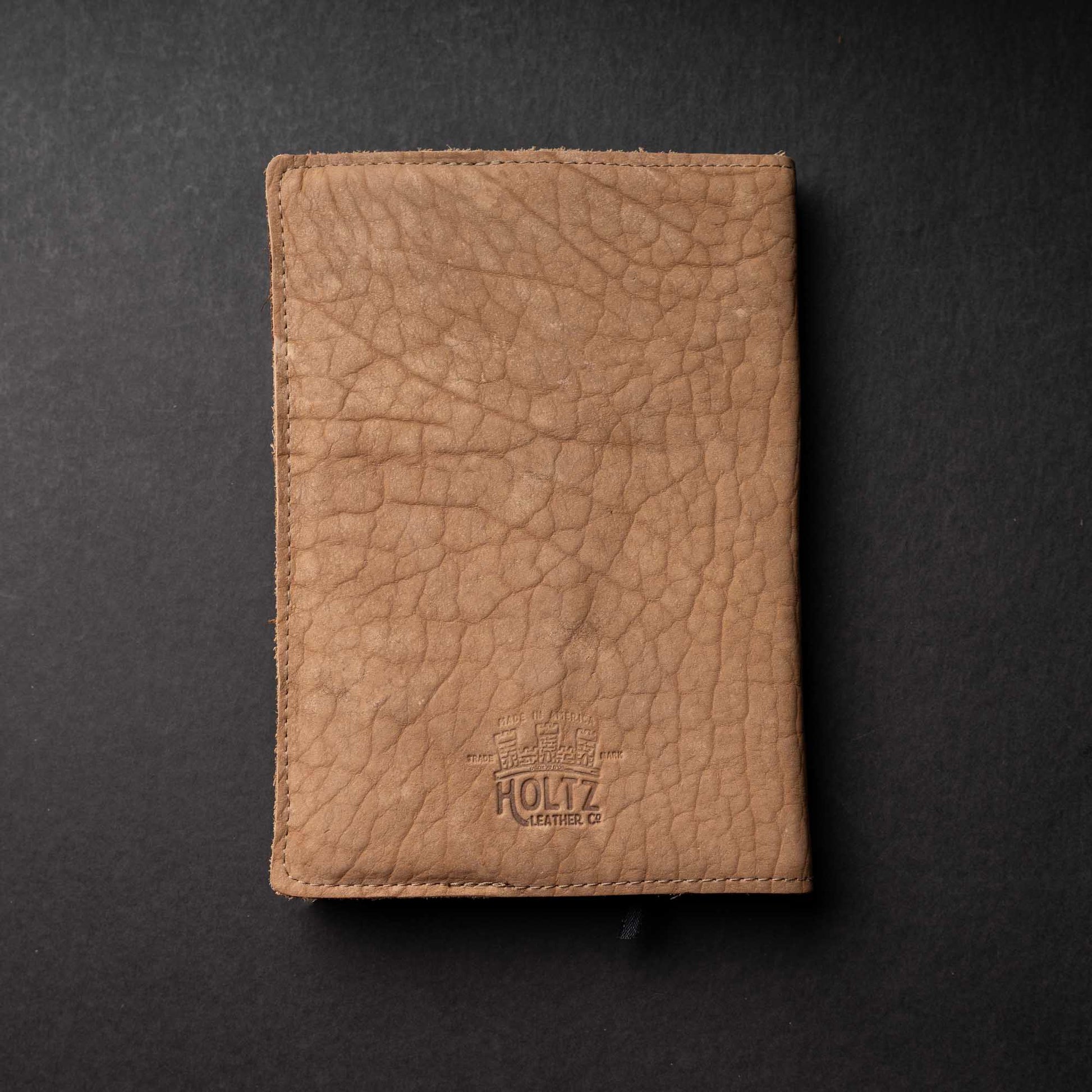 Hand Made Full Grain leather journal cover that comes with a 192 page A5 journal. This journal is handmade and can be personalized with your name or your initials! Made with tan shrunken bison leather.
